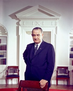 800px-Lyndon_B._Johnson,_photo_portrait,_leaning_on_chair,_color