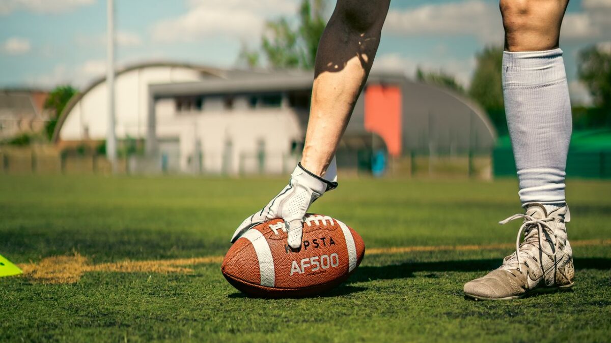 Man playing with a football.