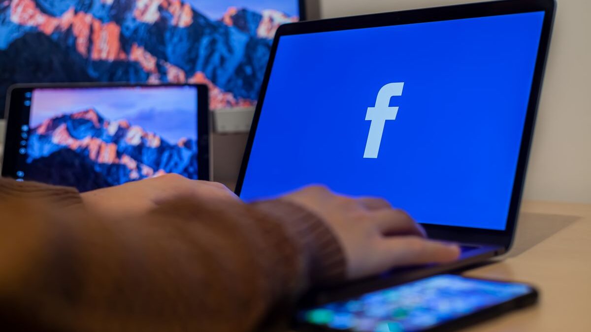 Computer screen with Facebook icon.