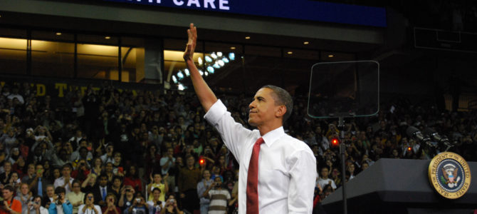 Obama touts Obamacare, waves to crowd
