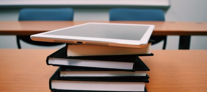 iPad on books, why classical school isn't possible