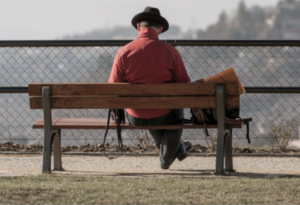 loneliness man sitting alone on a bench