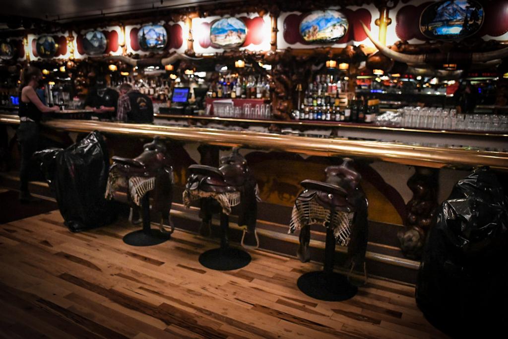 Saddle stools at the Million Dollar Cowboy Bar. Photo by Martin Avila.