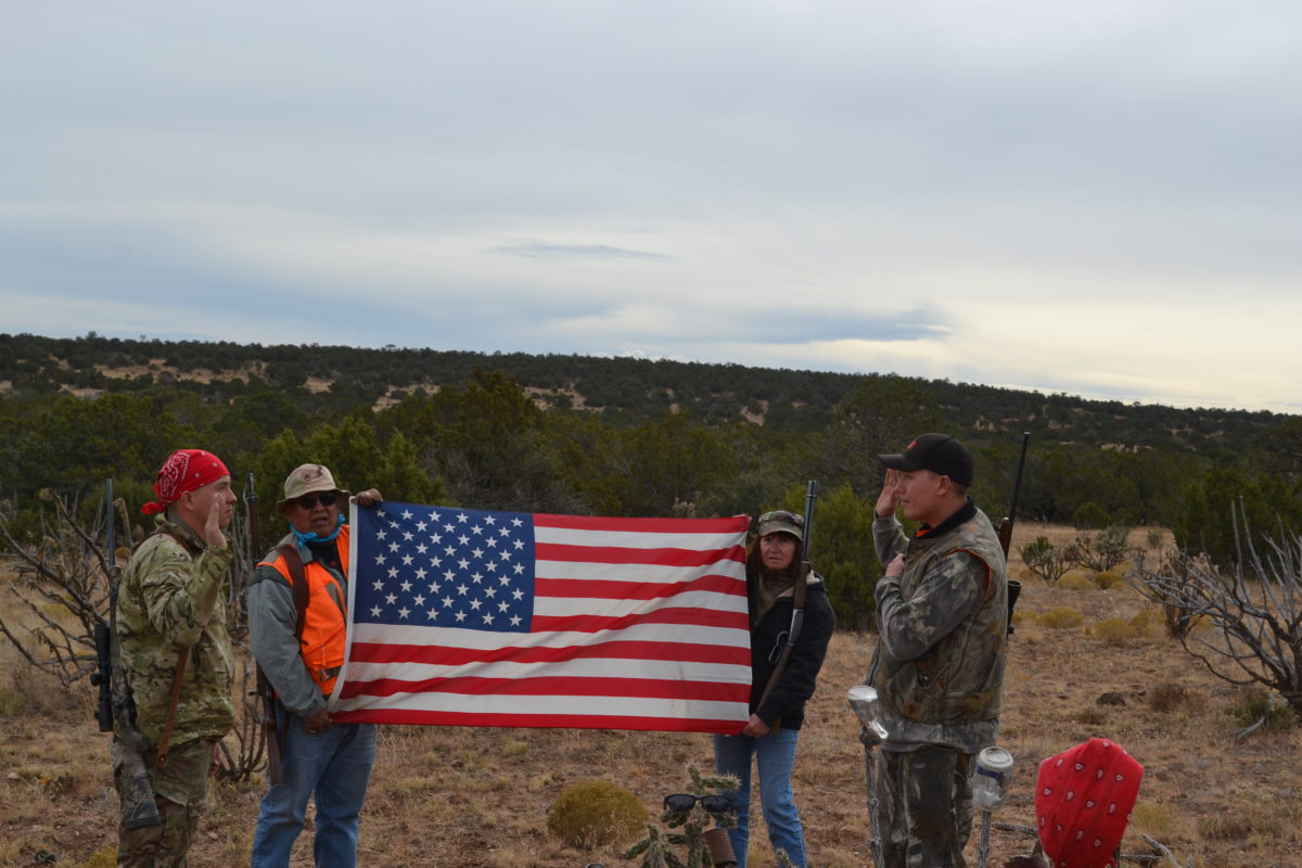 Then-Capt. Joseph Velasquez giving his brother his final re-enlistment on a hunting trip with their parents. Photo courtesy of Phillip Velasquez.