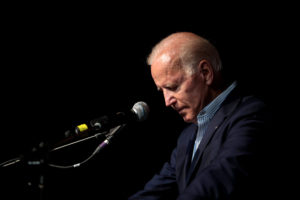 Joe Biden alone at the lectern in Iowa in 2019. Gage Skidmore/Flickr.