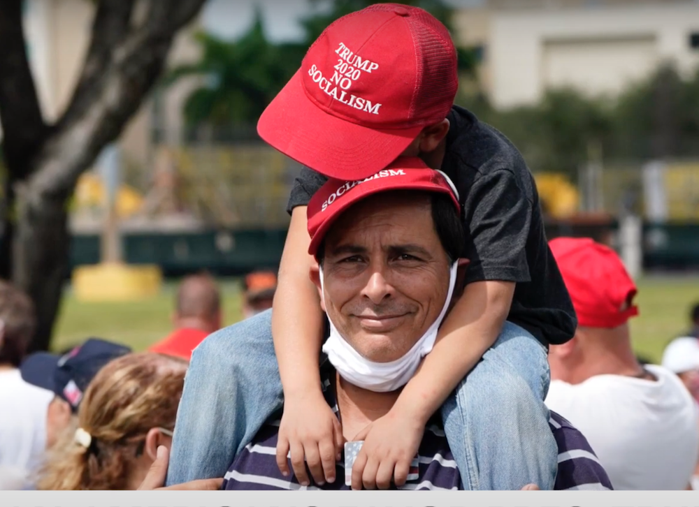 Man and child with pro-Trump hats