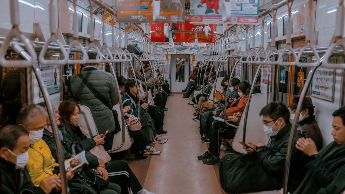 People wearing COVID masks on public transport