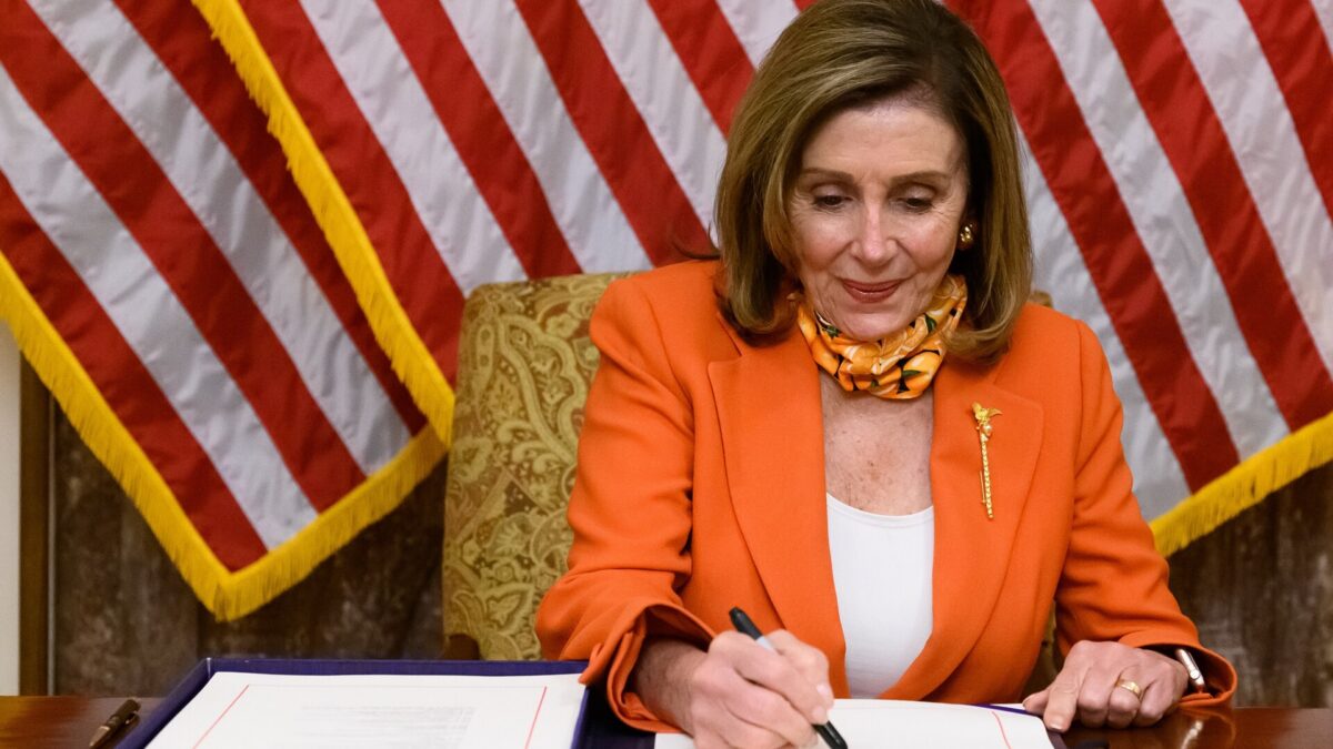 Nancy Pelosi signing legislation