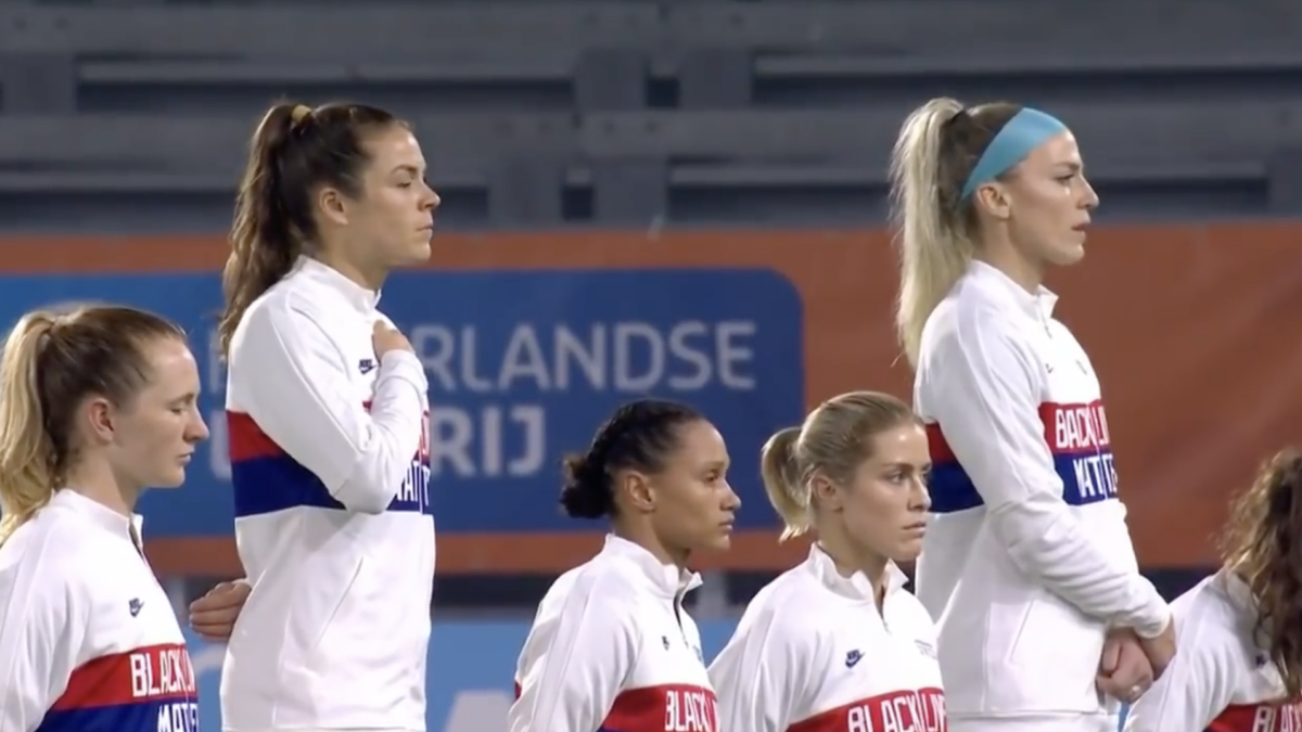 US women's soccer team members kneeling