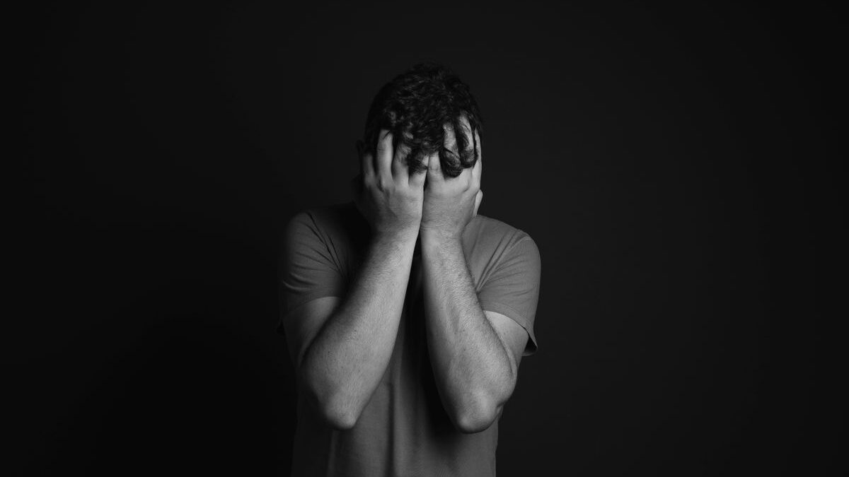 Man with his head in his hands