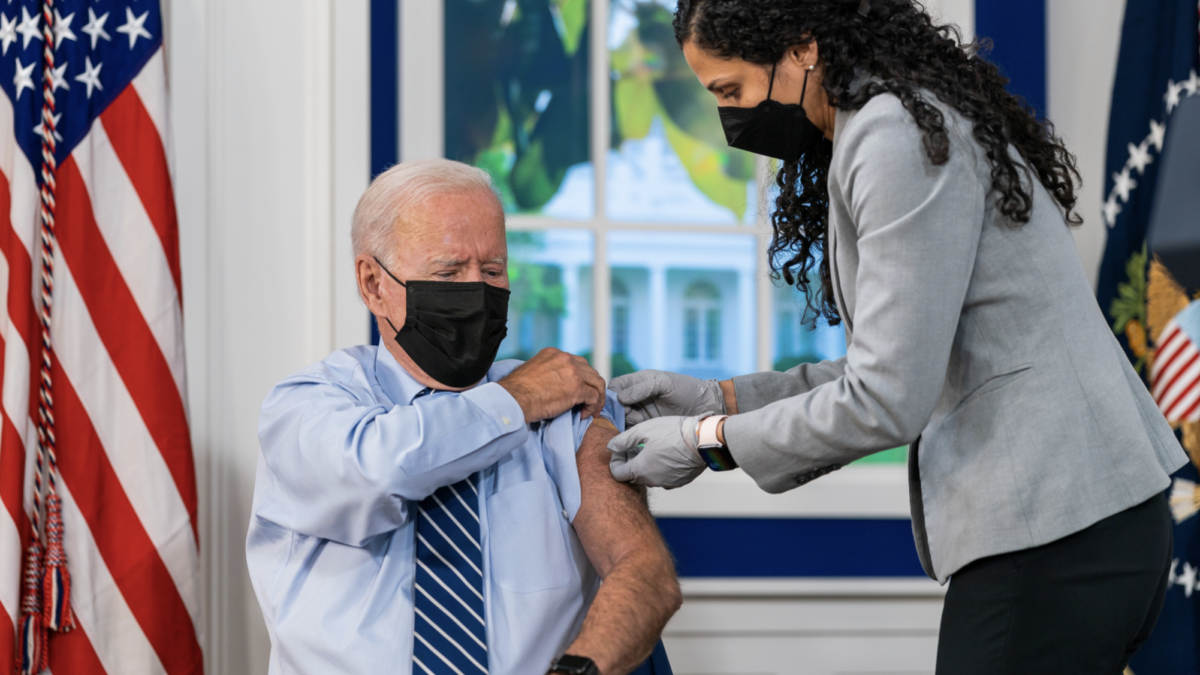 Joe Biden receiving a COVID booster shot