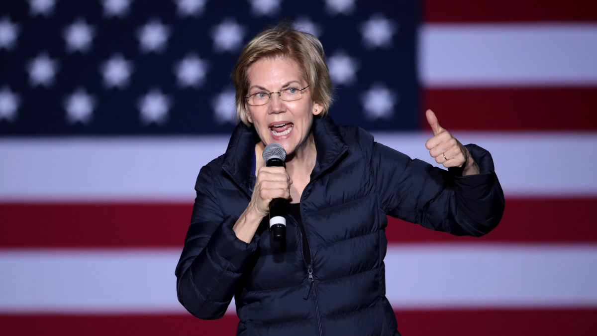 Elizabeth Warren shouting into microphone