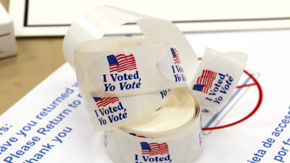 A bunch of "I Voted" stickers on a tabletop