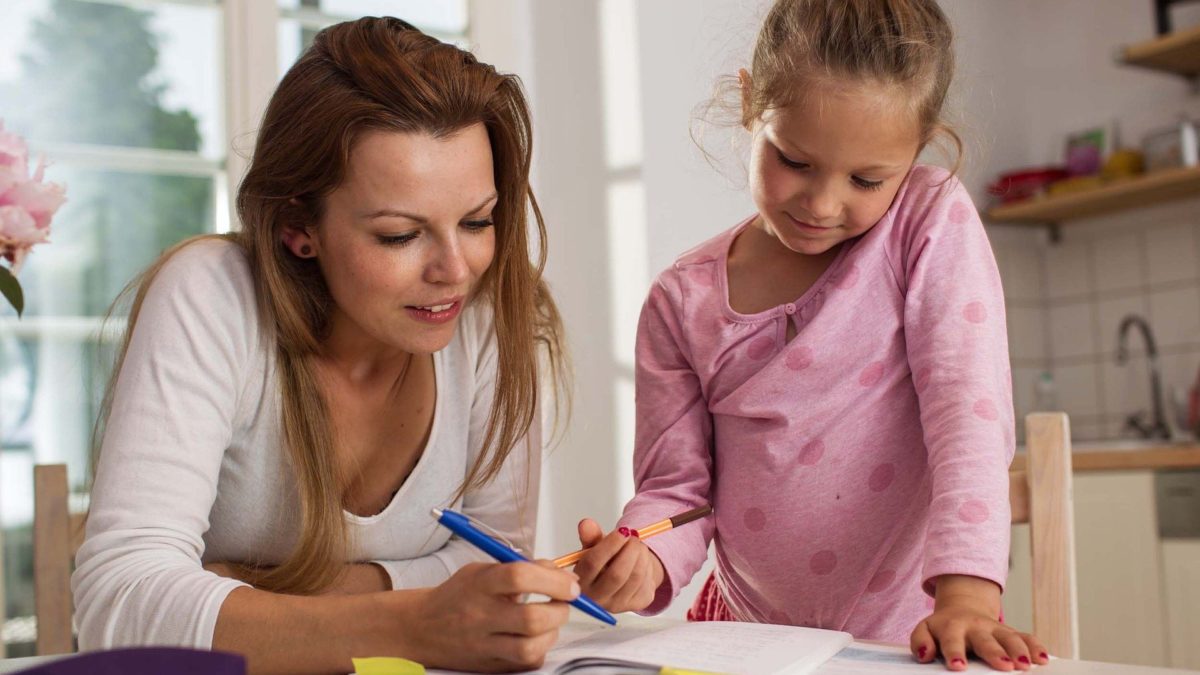 Mom helping daughter with school