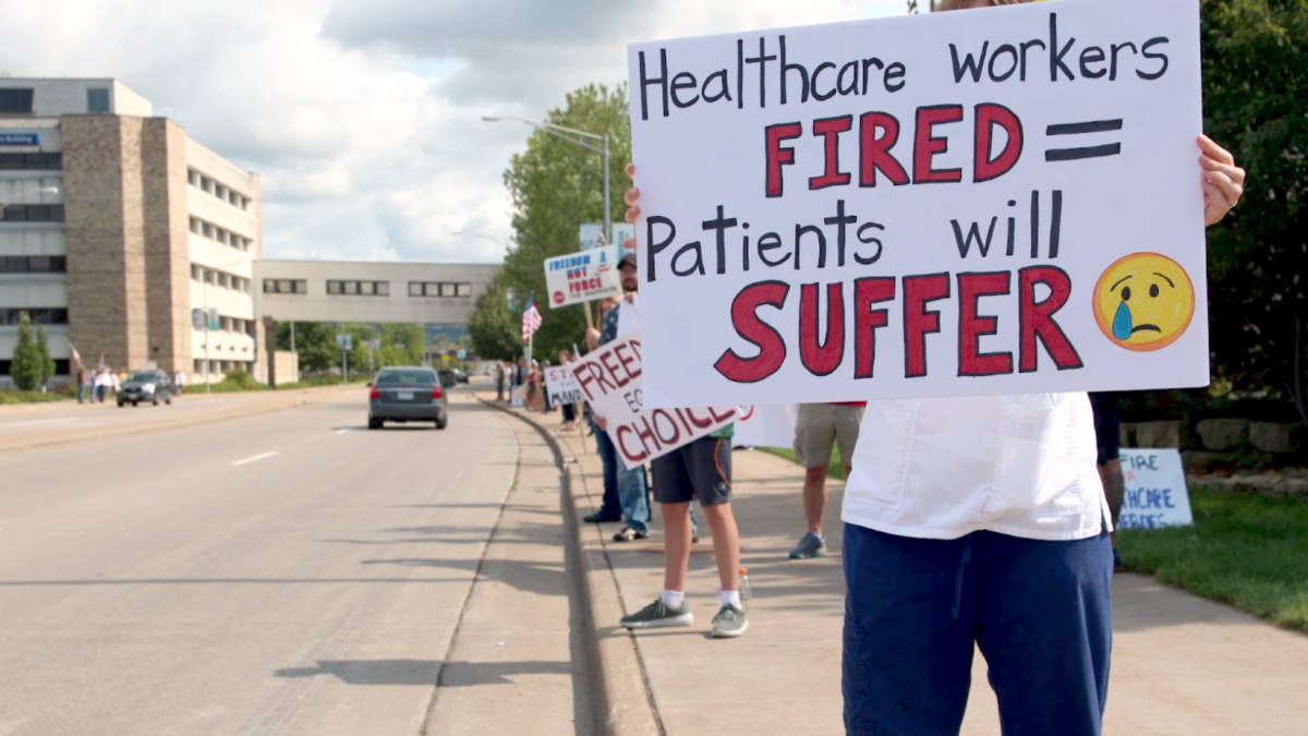 hospital system health care workers protest sign