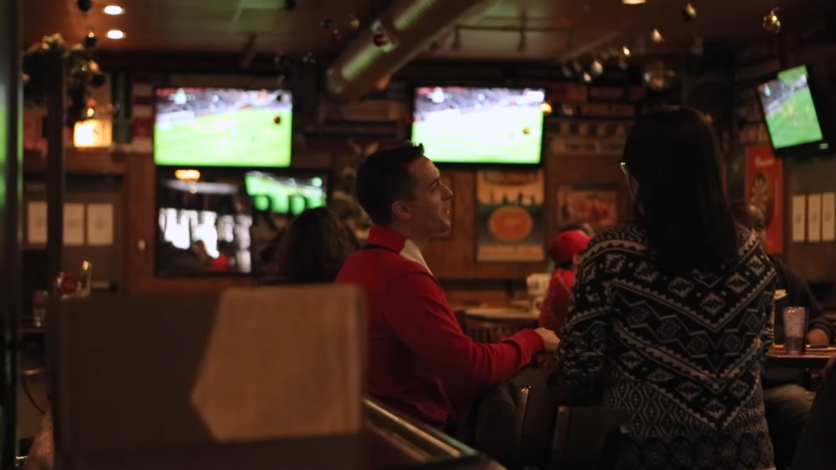 people talk at a sports bar