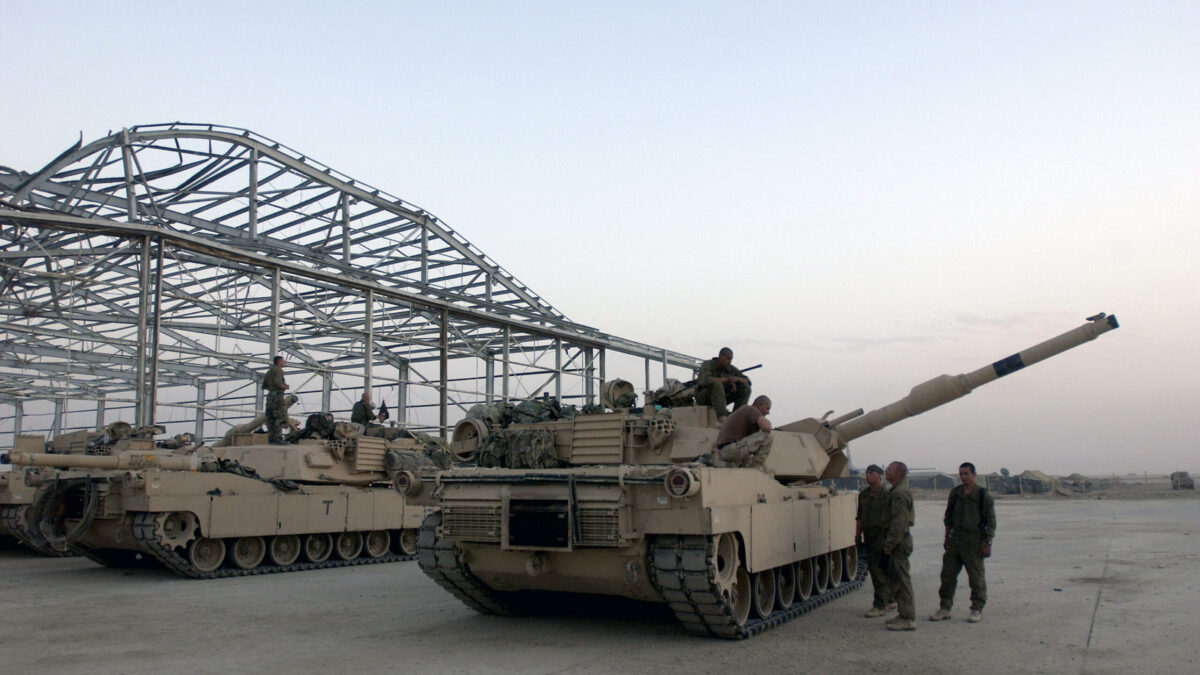 US Army (USA) M1A1 Abrams Main Battle Tanks (MBT) and their crewmembers from Charlie Company 3-1, 270th Armor, 1st Armored Division (AD), relax before re-deploying, at a forward-deployed location in support of Operation IRAQI FREEDOM.