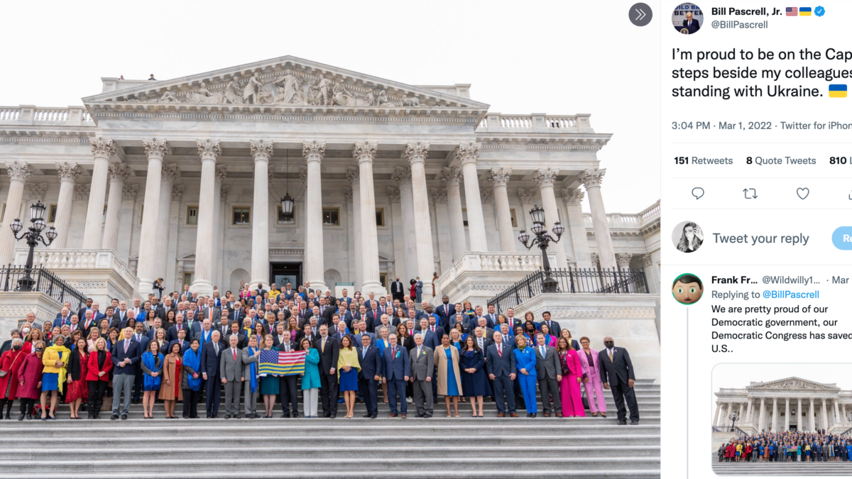 members of Congress on Capitol steps holding Ukraine flag