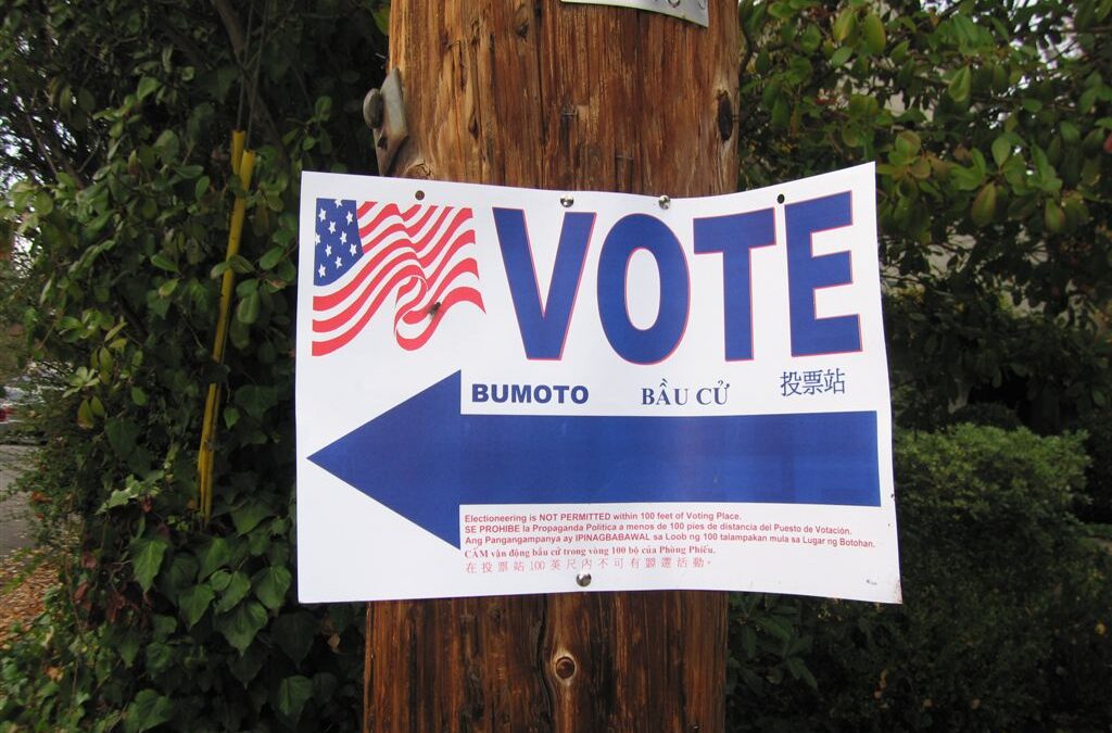 vote sign on pole