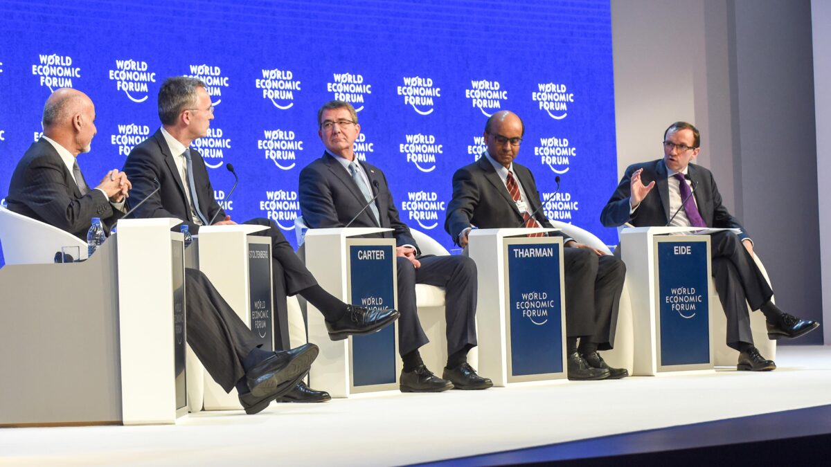 experts sit on stage at world economic panel