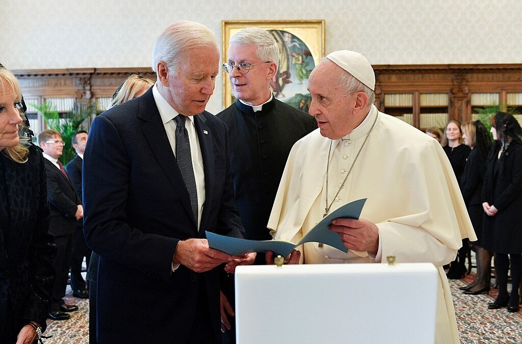 Biden talking to Pope Francis in Church