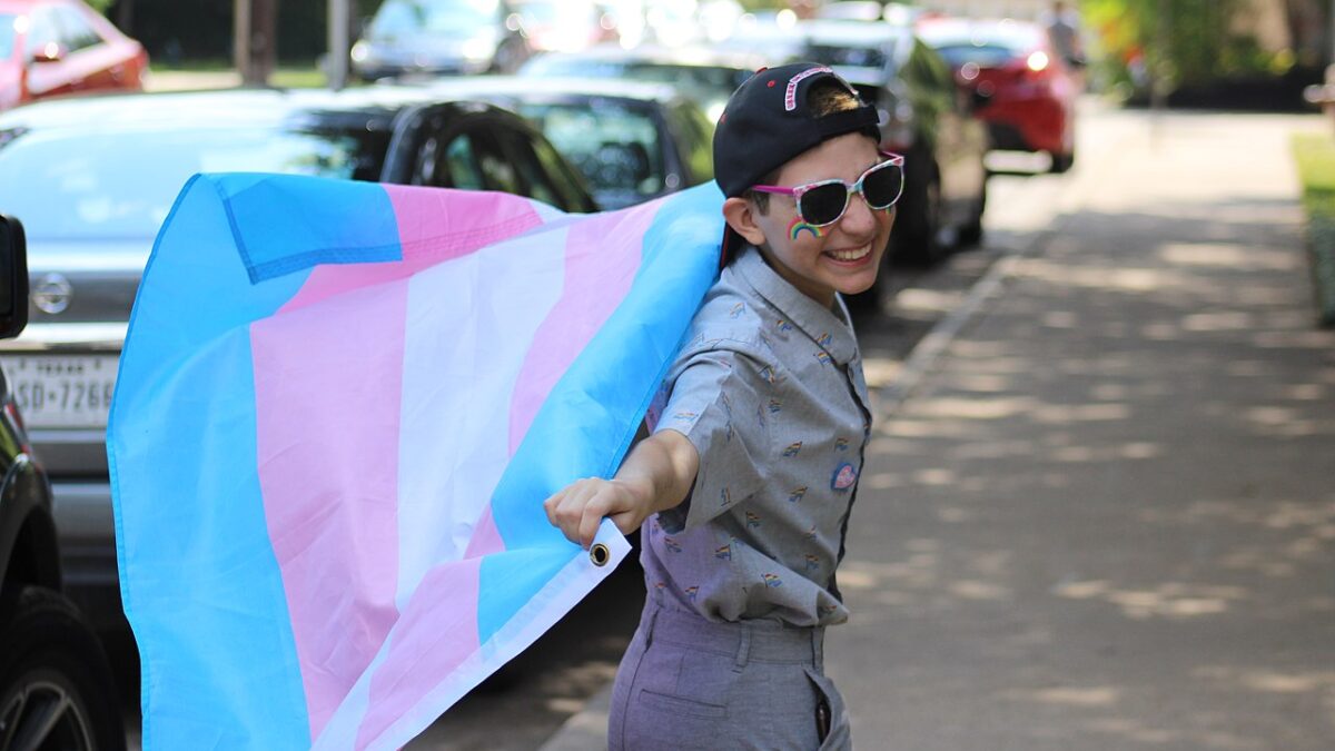 boy with trans flag