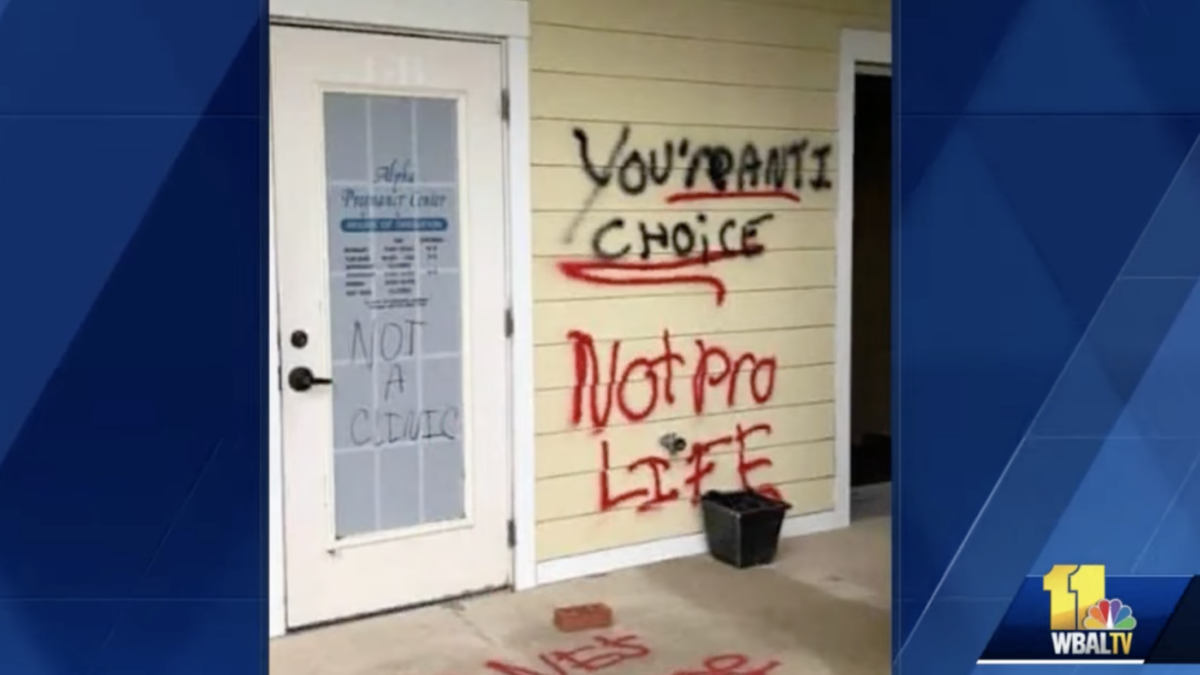 spray paint graffiti on door of pregnancy center