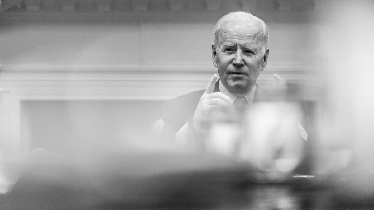 President Joe Biden sits at desk