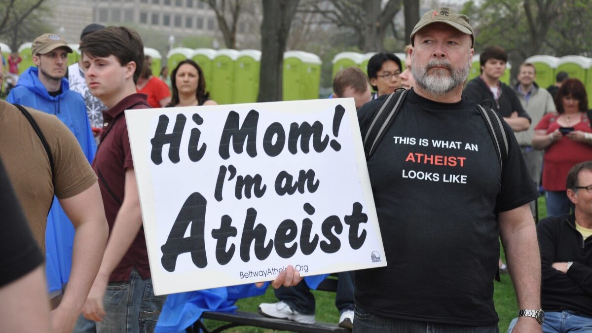 Man with atheist sign