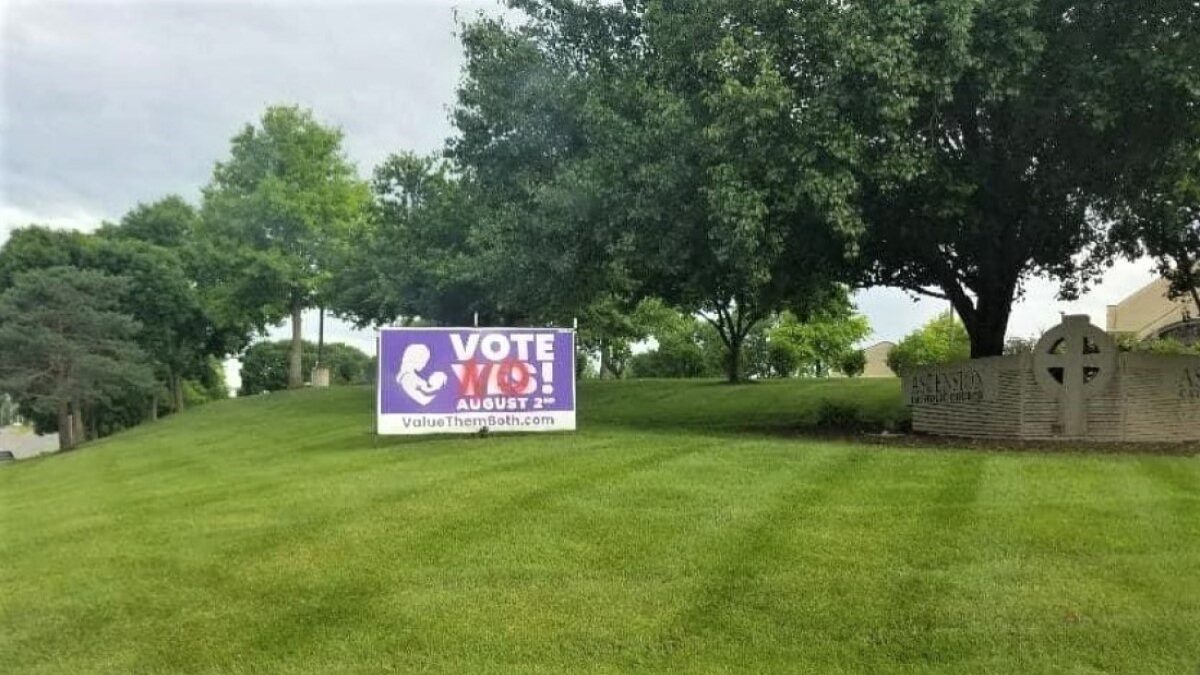 vandalized "vote yes" sign