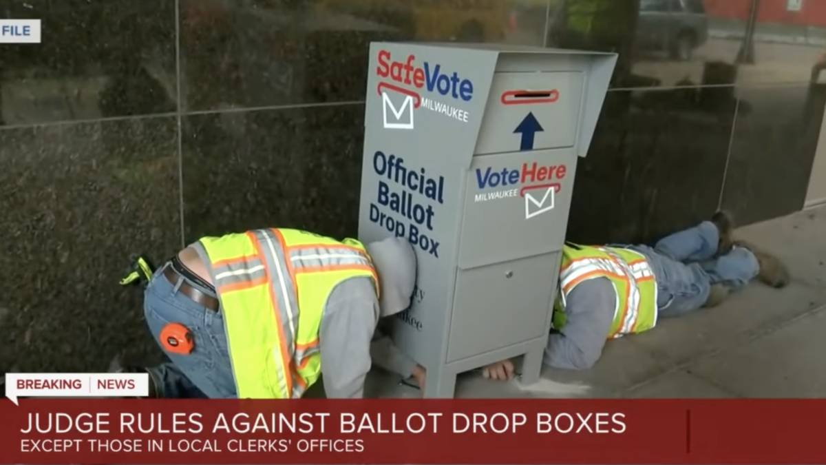 workers removing ballot drop box