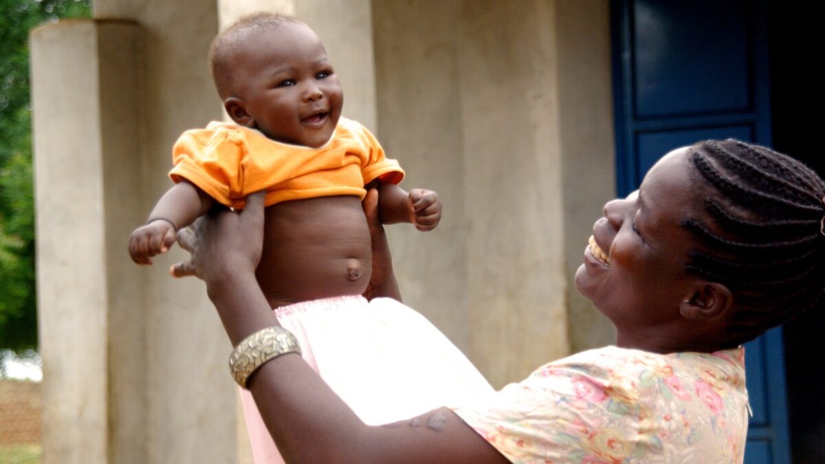 african woman holding baby
