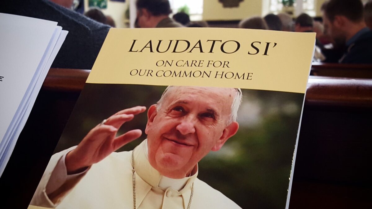 Pope Francis on cover of booklet in church pew
