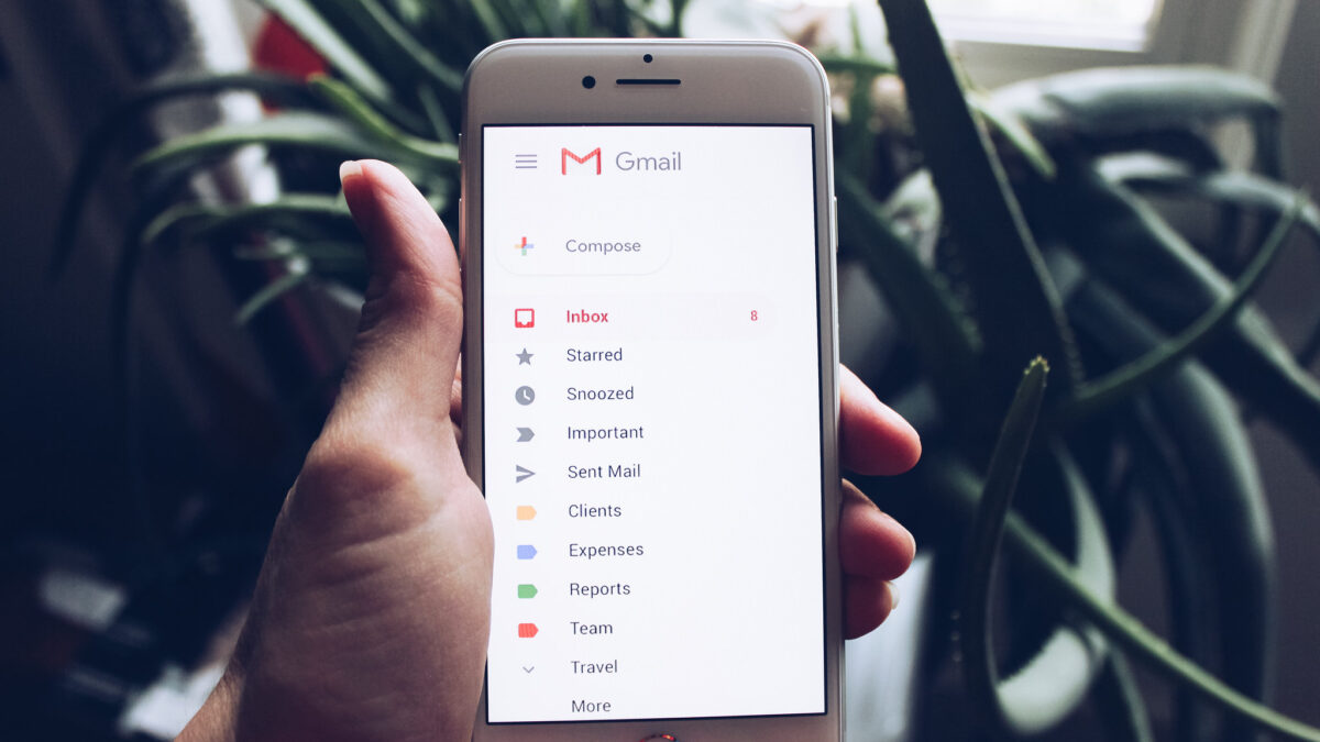 hand holding phone with gmail app open
