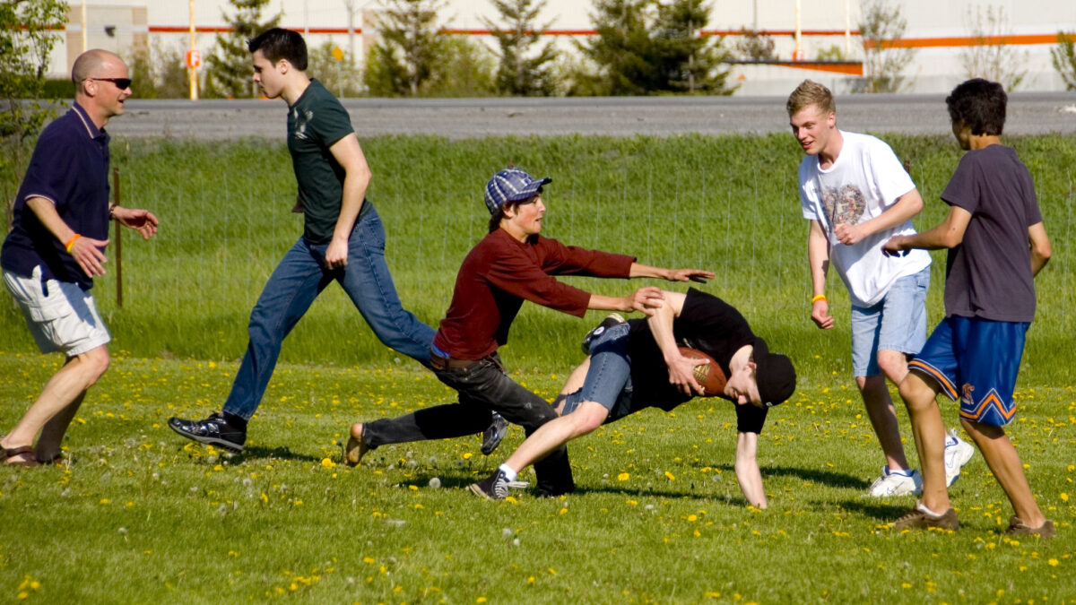 A group of people playing American football