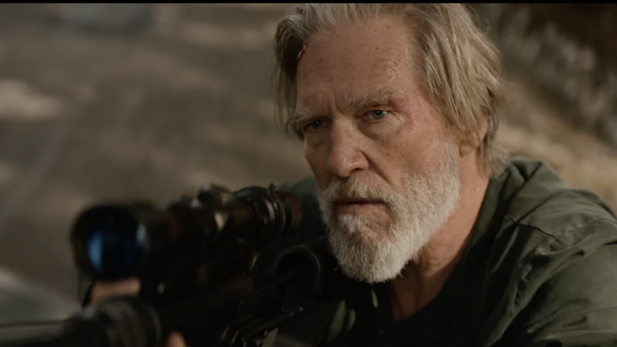 Jeff Bridges old man actor behind scope of long rifle