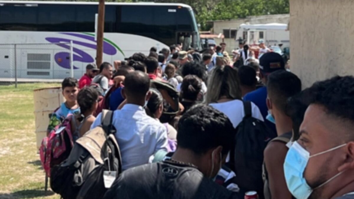 Migrants entering a bus