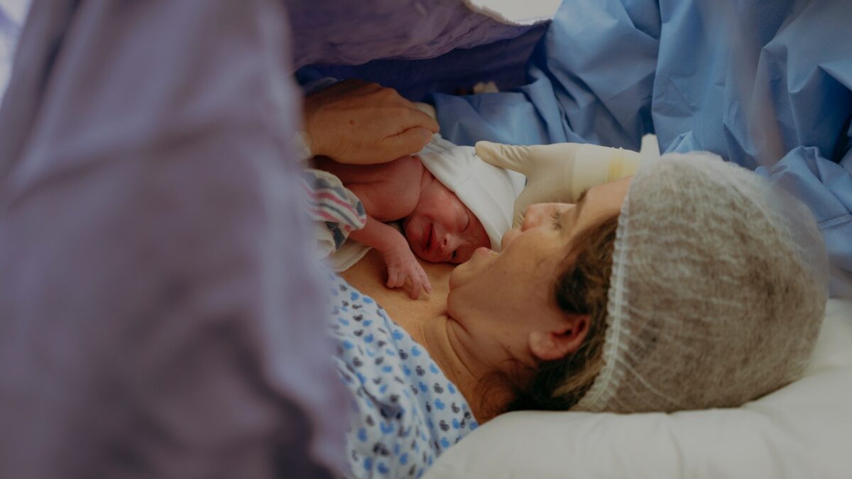 mom holding baby right after birth