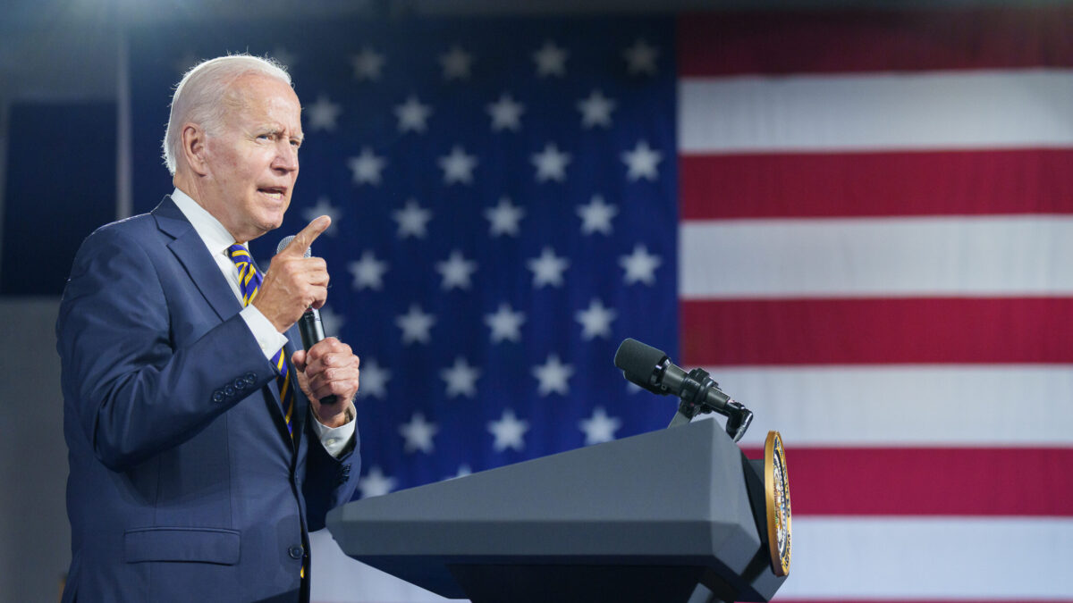 Joe Biden speaks in front of American flag