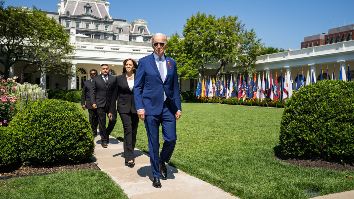 President Joe Biden, Vice President Kamala Harris, joined by guest speakers Garnell Whitfield Jr, and Dr. Roy Guerrero, walk through the Rose Garden to attend an event celebrating the passage of the Bipartisan Safer Communities Act, Monday, July 11, 2022, on the South Lawn of the White House.(Official White House Photo by Adam Schultz)