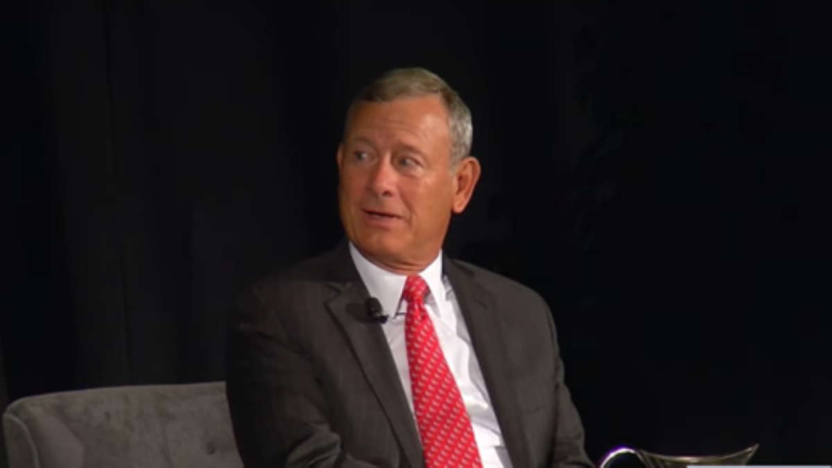 John Roberts speaking at a conference