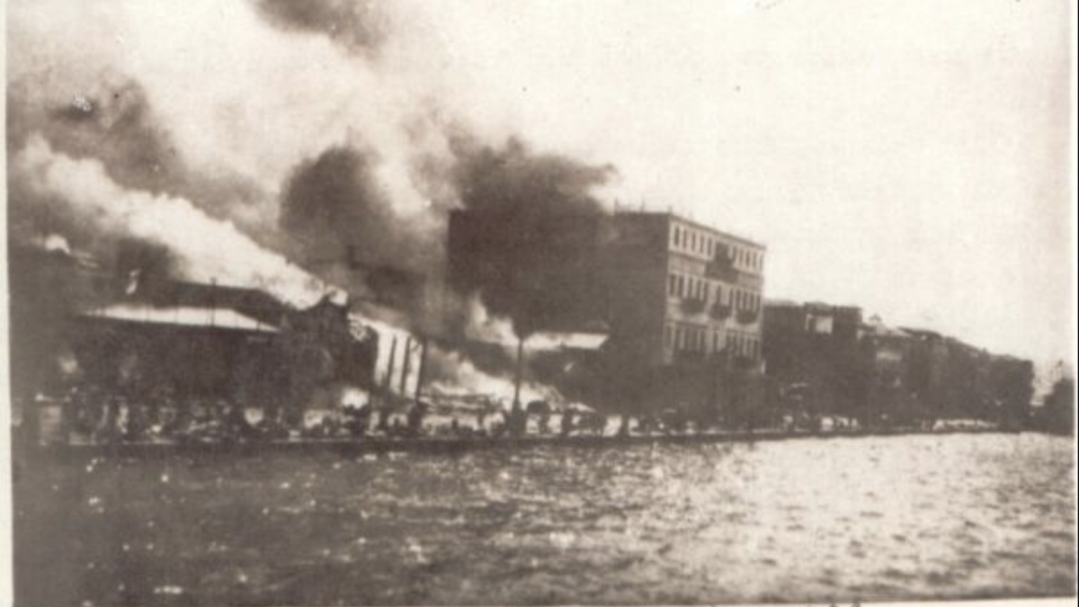 old photo of city buildings on fire