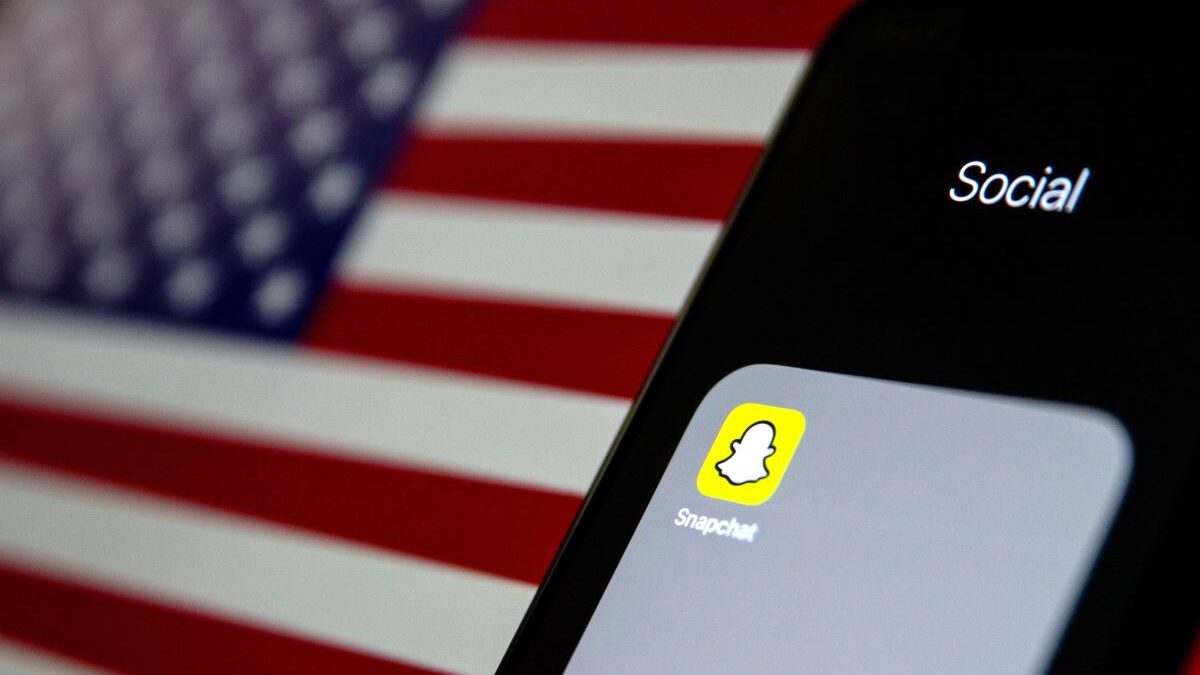 Snapchat app with American flag backdrop