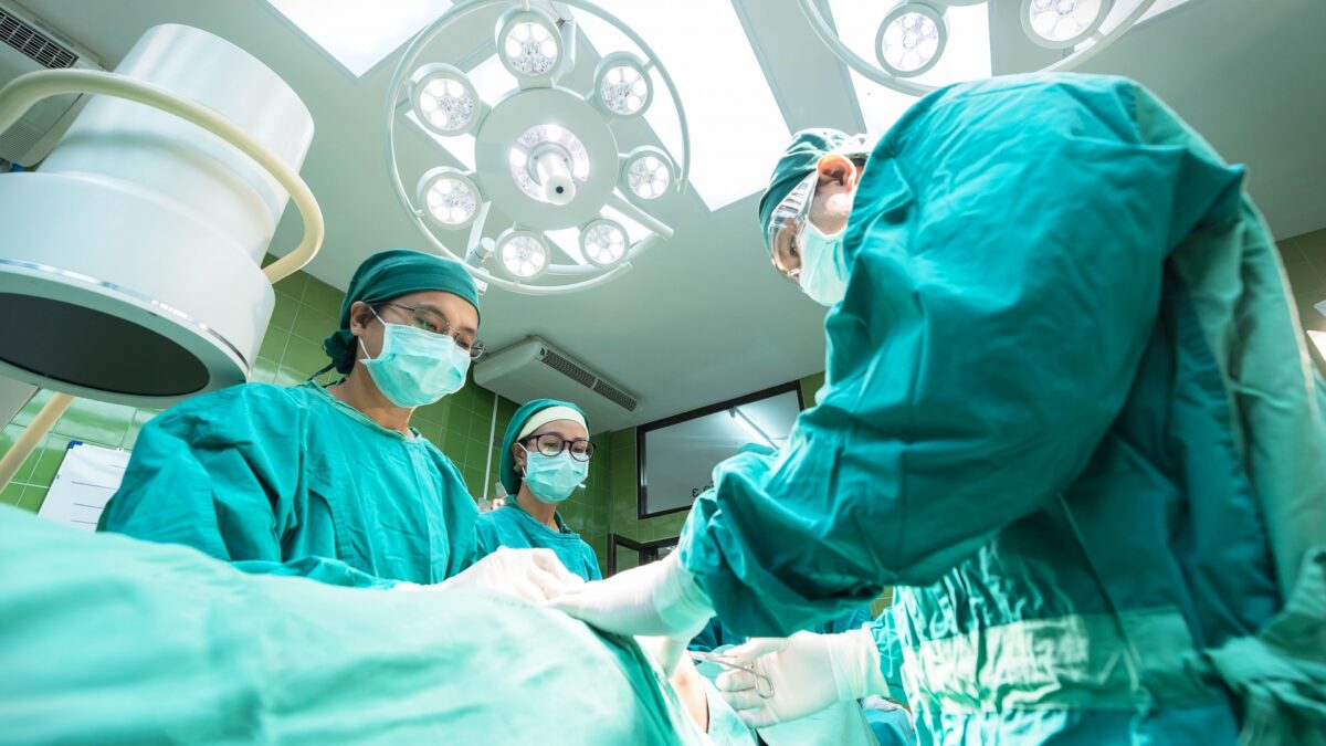 doctors perform surgery in operating room