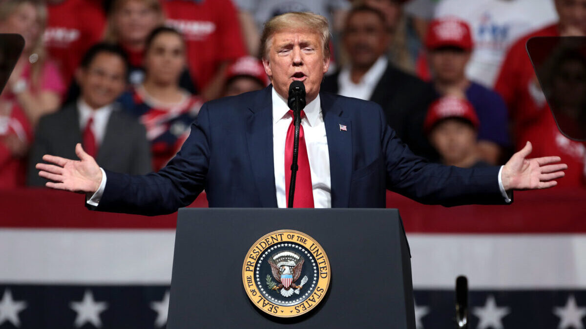 Donald Trump giving a speech at a rally