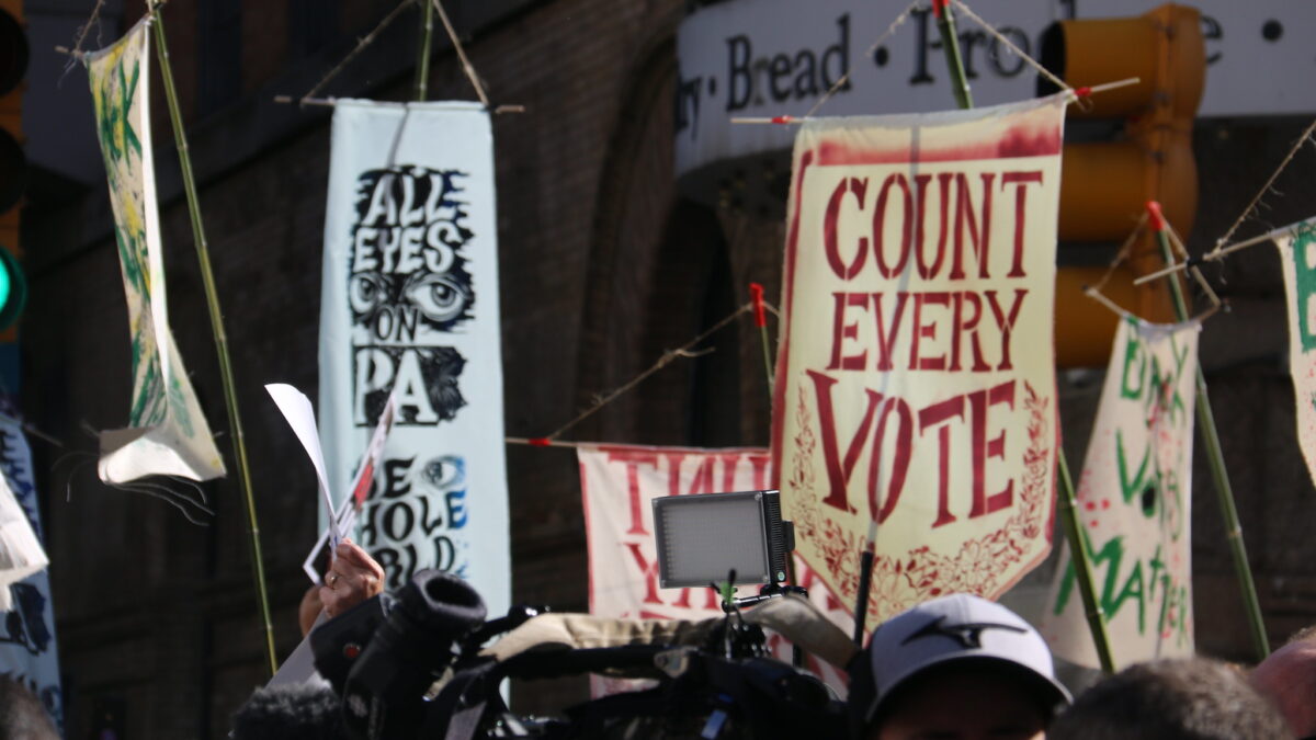 Person holding 'count every vote' sign in Philadelphia Pennsylvania