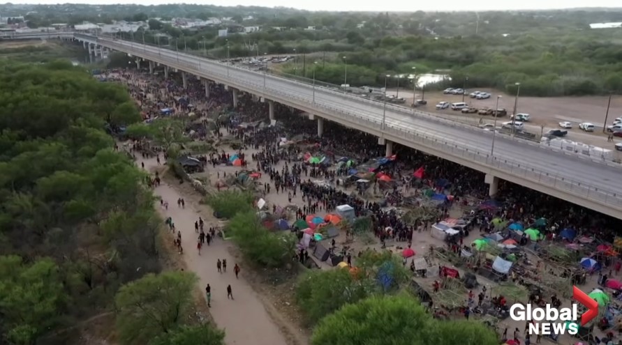 Thousands of migrants under a bridge in Texas