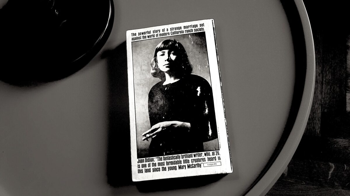 Paperback Joan Didion novel sitting on table