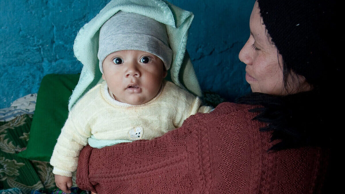 Guatemalan woman holding a baby