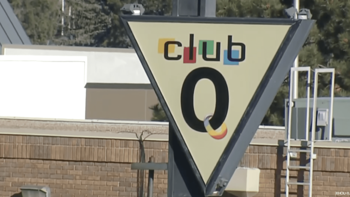 white triangle sign outside of gay nightclub